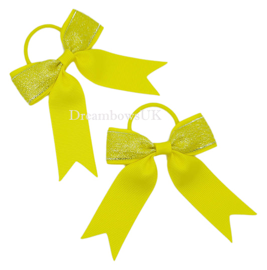 Yellow glitter hair bows on thin bobbles