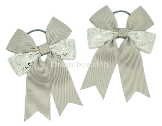 Silver and white novelty bows on thin bobbles