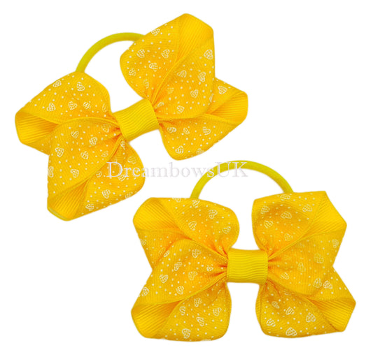 Golden yellow hearts design hair bows on thick bobbles