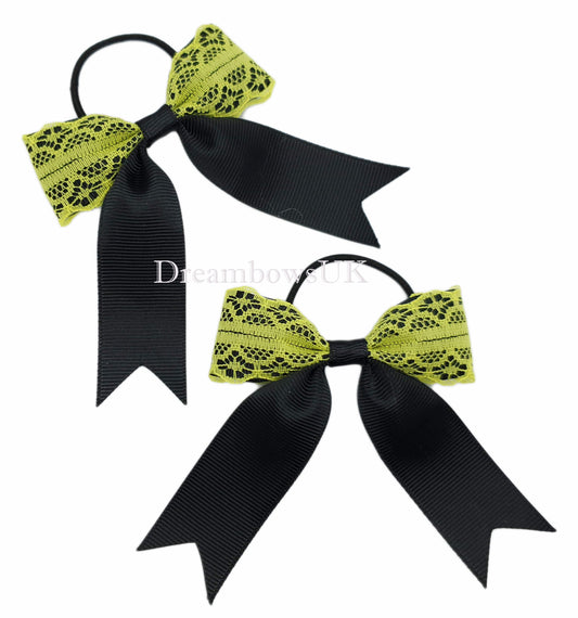 Black and yellow lace bows on thin bobbles