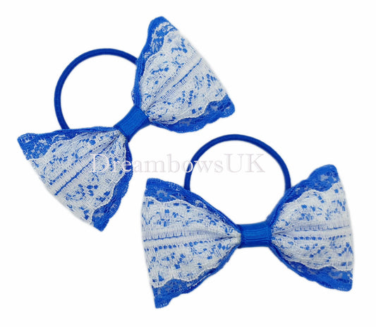 Royal blue and white lace hair bows on thin bobbles