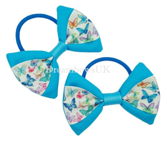 Turquoise and white butterfly design bows on thick bobbles