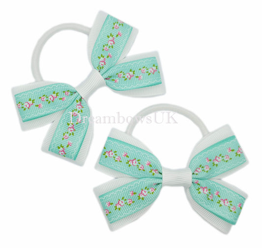 Pastel green and white floral hair bows on thick bobbles