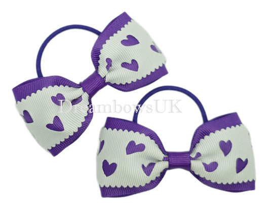 Purple and white hearts design hair bows on thin bobbles