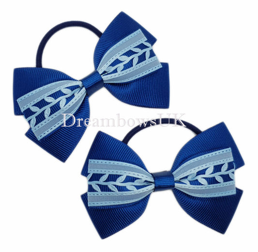 Navy blue and baby blue novelty hair bows on thin bobbles