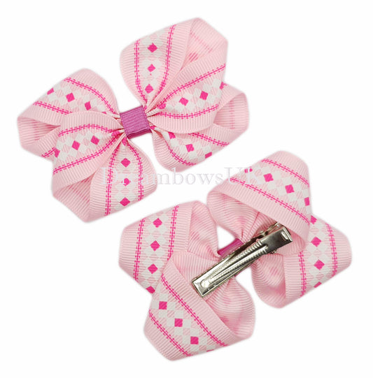 Baby pink and white novelty hair bows on alligator clips