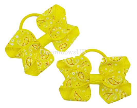 Yellow paisley hair bows on thick bobbles