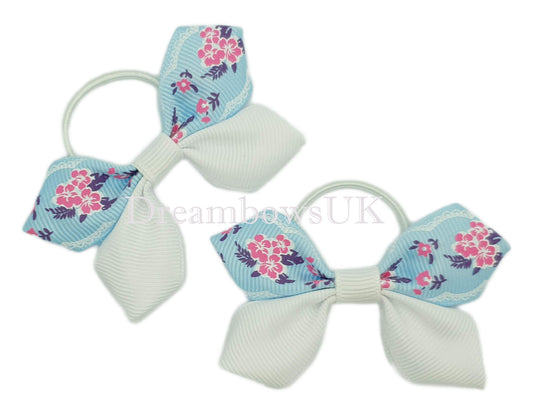 Baby blue and white floral hair bows on thin bobbles