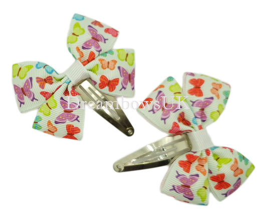 Colourful butterfly design hair bows on snap clips