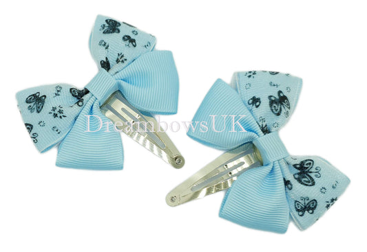 Baby blue butterfly design hair bows on snap clips