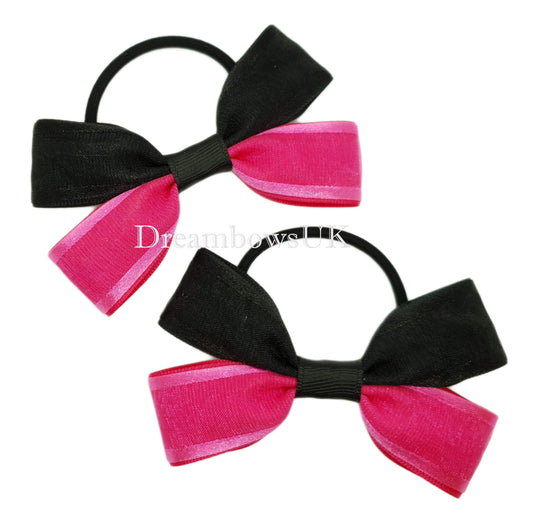 Black and cerise pink organza bows on thick bobbles
