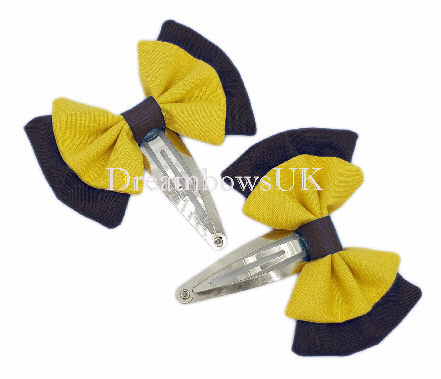 2x Black and golden yellow fabric hair bows