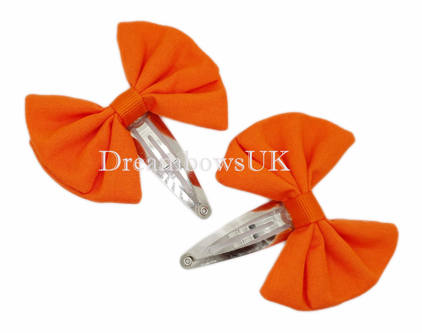 2x Orange fabric hair bows