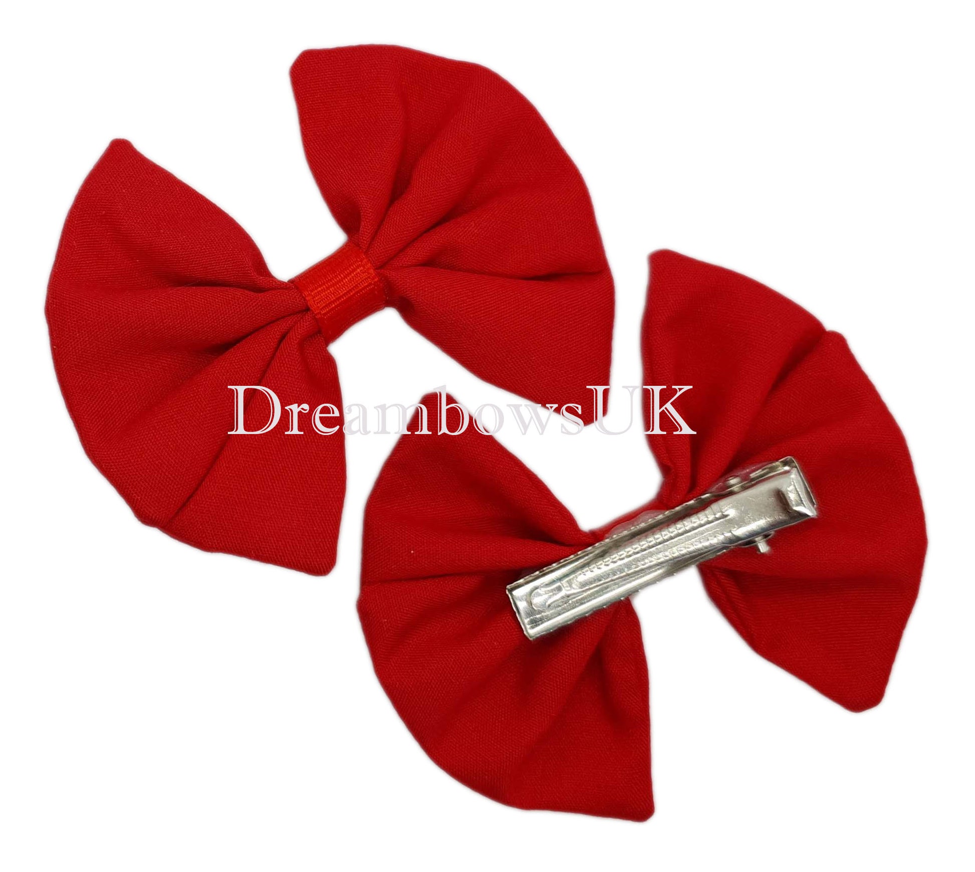 Red fabric hair bows on alligator clips
