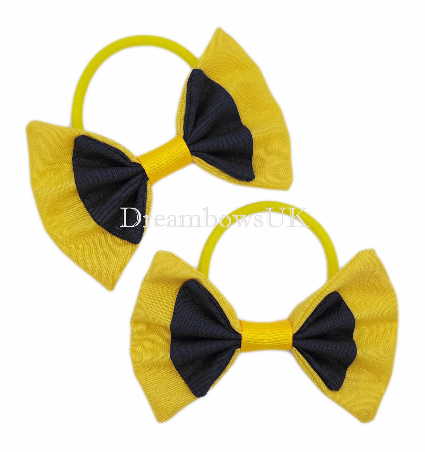 2x Black and golden yellow fabric hair bows