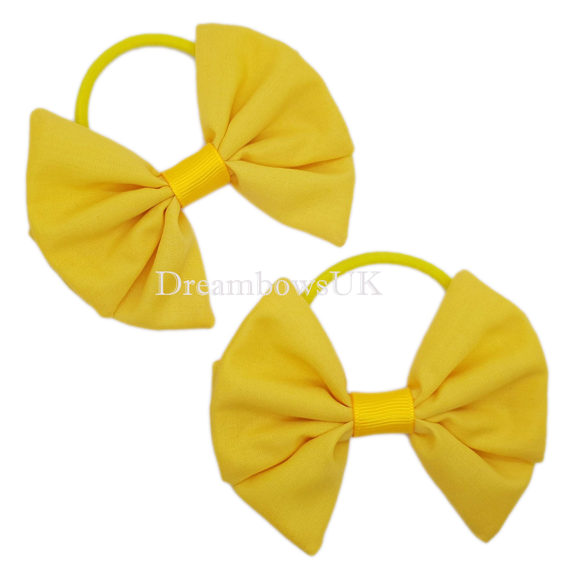 Golden yellow hair bows on thick hair bobbles