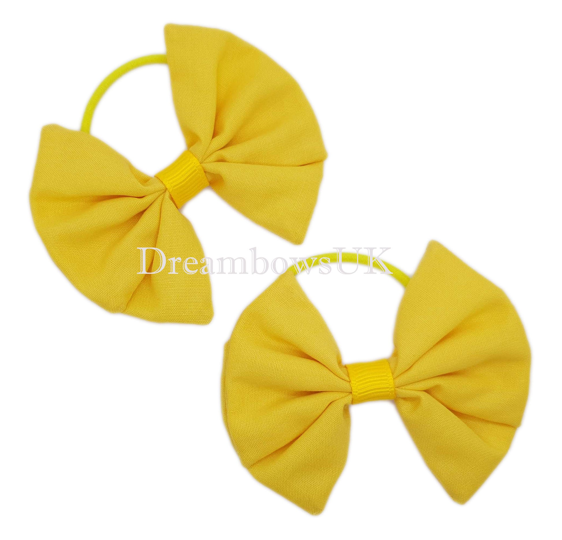 Golden yellow school bows on thin hair ties