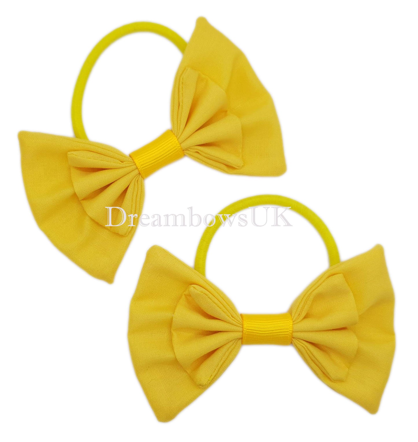 Golden yellow fabric hair bows on thick hair ties