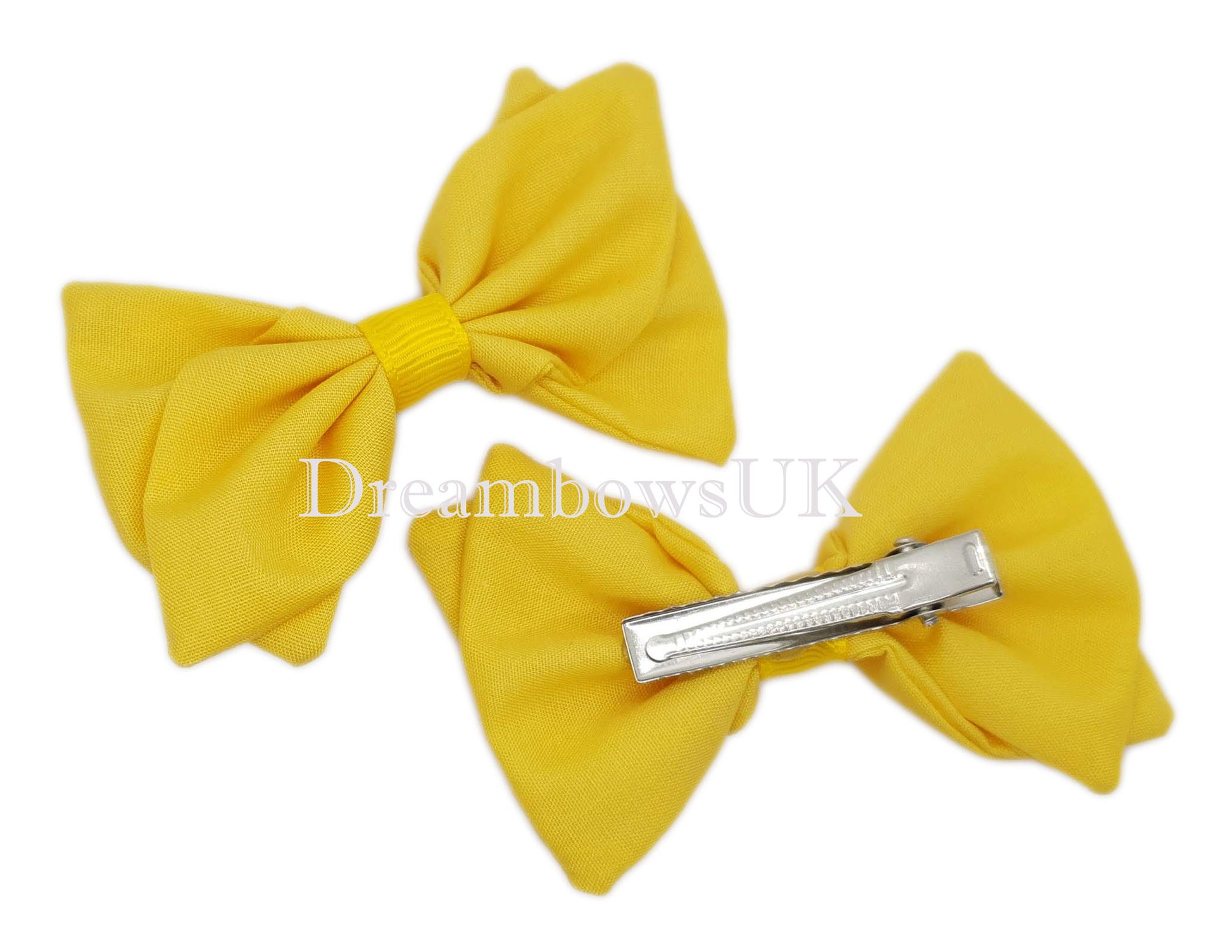 Golden yellow school bows on alligator clips